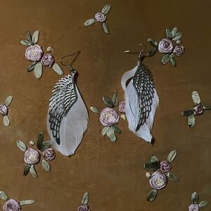 Feather and metal wing earrings